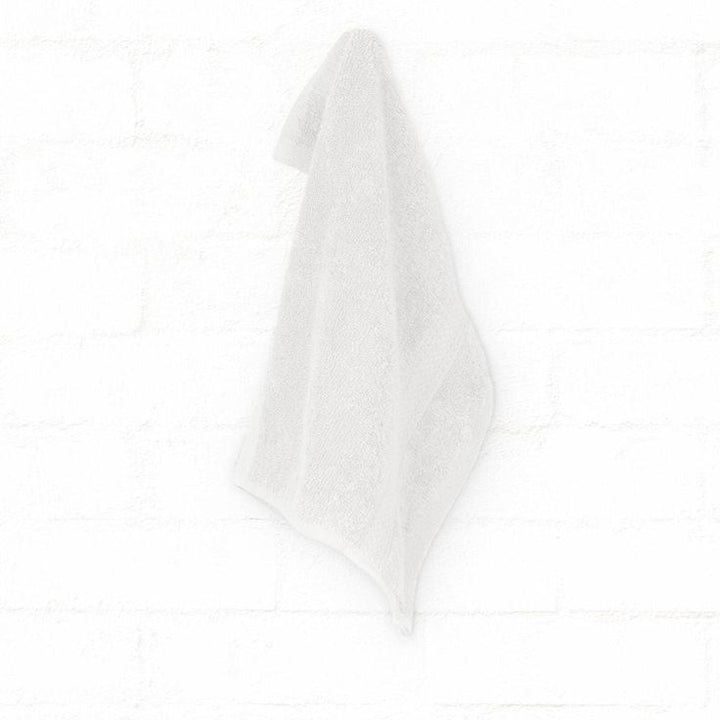 Luxury Bedsy Premium White Cotton Bath Towel displayed in a modern bathroom, 500 GSM thick cotton, soft and absorbent for hotel-style comfort.