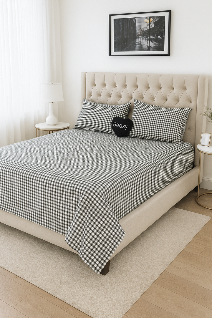 Bedsy ClassicCottage bedsheet set styled in a minimalist bedroom, showcasing the crisp cotton percale texture and classic design with matching pillowcases.