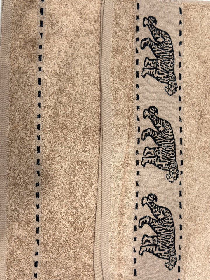 Luxury Bedsy Tigers Hand Towel displayed in a bathroom setting, soft and absorbent 100% cotton, lightweight and durable for hotel-style comfort.