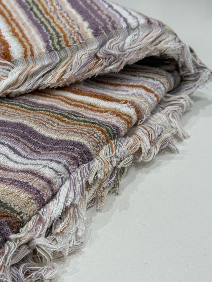 Stylish Bedsy cotton towel in multicolor stripes with fringes, displayed as a bath, spa, or beach towel for modern luxury bathrooms.