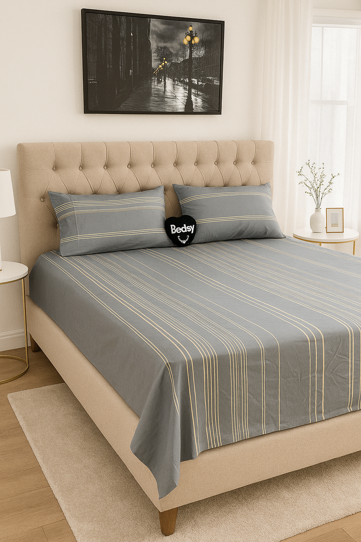 Bedsy SkylineSatin bedsheet set displayed on a modern bed, showing its cotton satin sheen and elegant vertical stripe design, with matching pillowcases for a minimalist bedroom.